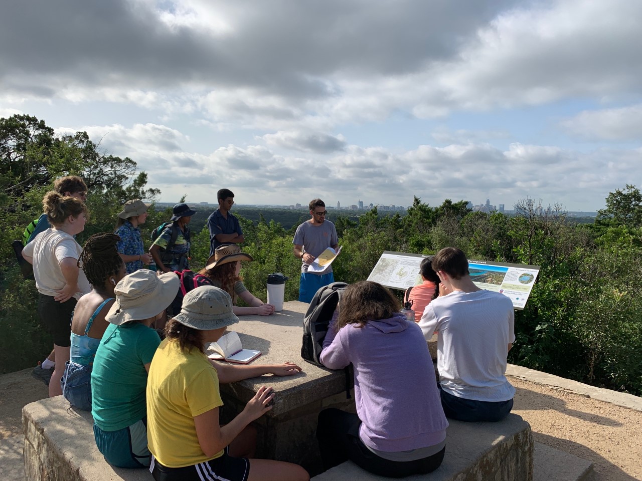 Dr. Moss discussing faults on top of Mt. Bonnell